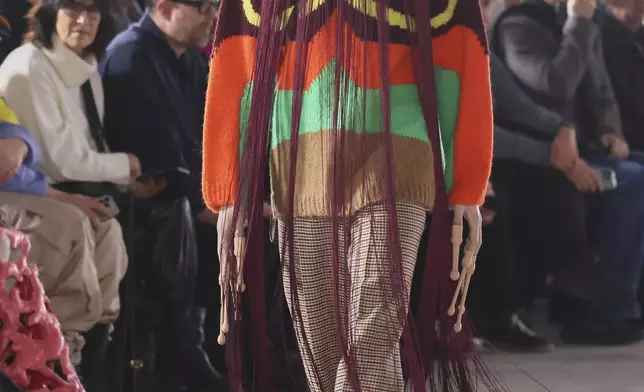 A model wears a creation as part of the men's Walter van Beirendonck Fall-Winter 2025-2026 collection, that was presented in Paris, Wednesday, Jan. 22, 2025. (AP Photo/Thomas Padilla).