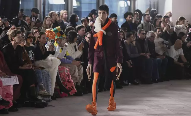 A model wears a creation as part of the men's Walter van Beirendonck Fall-Winter 2025-2026 collection, that was presented in Paris, Wednesday, Jan. 22, 2025. (AP Photo/Thomas Padilla).