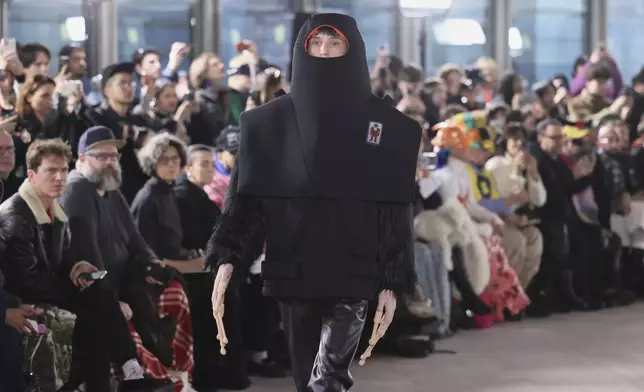 A model wears a creation as part of the men's Walter van Beirendonck Fall-Winter 2025-2026 collection, that was presented in Paris, Wednesday, Jan. 22, 2025. (AP Photo/Thomas Padilla).