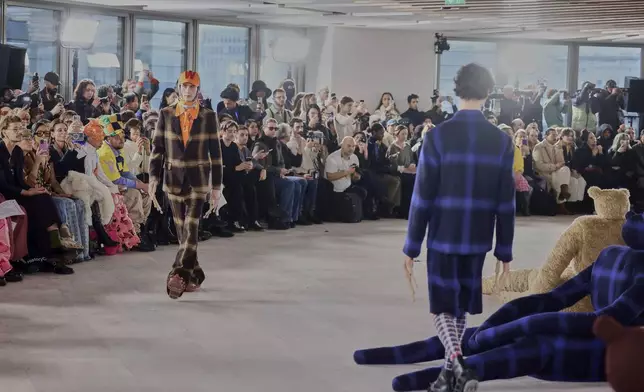 A model wears a creation as part of the men's Walter van Beirendonck Fall-Winter 2025-2026 collection, that was presented in Paris, Wednesday, Jan. 22, 2025. (AP Photo/Thomas Padilla).