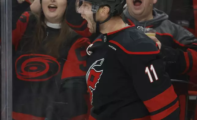 Carolina Hurricanes' Jordan Staal (11) celebrates after his goal against the Toronto Maple Leafs during the second period of an NHL hockey game in Raleigh, N.C., Thursday, Jan. 9, 2025. (AP Photo/Karl DeBlaker)