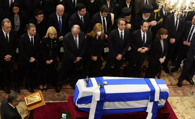 From left to right Greek President Katerina Sakellaropoulou, Cyprus' President Nikos Christodoulides, Greece's Prime Minister Kyriakos Mitsotakis and his wife Mareva Grabowski-Mitsotakis attend the state funeral of the late Costas Simitis former Prime Minister of Greece in Athens' central cathedral, Thursday, Jan. 9, 2025. (AP Photo/Petros Giannakouris)