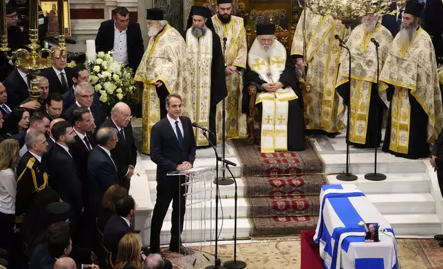 Greece's Prime Minister Kyriakos Mitsotakis delivers a eulogy during the state funeral of the late Costas Simitis former Prime Minister of Greece in Athens' central cathedral, Thursday, Jan. 9, 2025. (AP Photo/Petros Giannakouris)