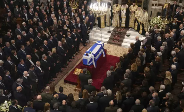 Relatives and officials attend the state funeral of the late Costas Simitis former Prime Minister of Greece in Athens' central cathedral, Thursday, Jan. 9, 2025. (AP Photo/Petros Giannakouris)