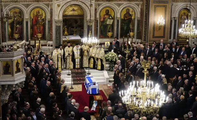 Relatives and officials attend the state funeral of the late Costas Simitis former Prime Minister of Greece in Athens' central cathedral, Thursday, Jan. 9, 2025. (AP Photo/Petros Giannakouris)