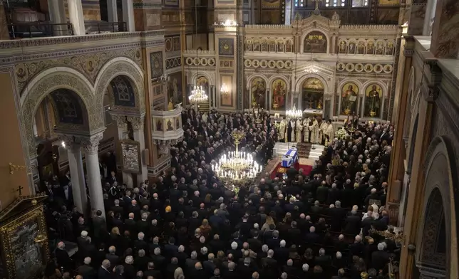 Relatives and officials attend the state funeral of the late Costas Simitis former Prime Minister of Greece in Athens' central cathedral, Thursday, Jan. 9, 2025. (AP Photo/Petros Giannakouris)