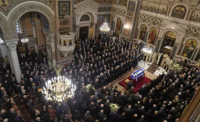 Relatives and officials attend the state funeral of the late Costas Simitis former Prime Minister of Greece in Athens' central cathedral, Thursday, Jan. 9, 2025. (AP Photo/Petros Giannakouris)