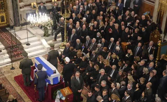 Relatives and officials attend the state funeral of the late Costas Simitis former Prime Minister of Greece in Athens' central cathedral, Thursday, Jan. 9, 2025. (AP Photo/Petros Giannakouris)