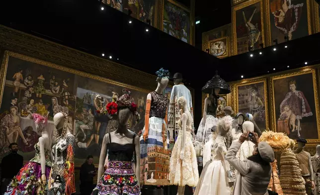 Creations are displayed during the exhibition "From the Heart to the Hands: Dolce&amp;Gabbana" at the Grand Palais, in Paris, Thursday, Jan. 9, 2025. (AP Photo/Thibault Camus)