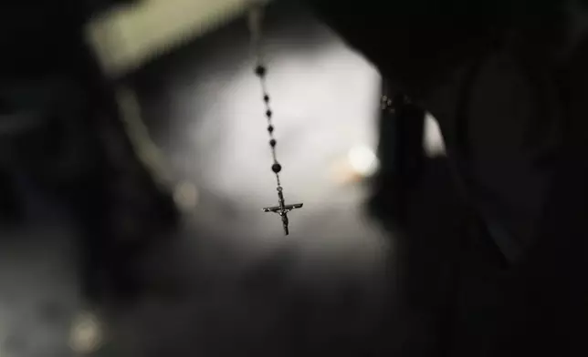 A rosary is seen on a creation displayed during the exhibition "From the Heart to the Hands: Dolce&amp;Gabbana" at the Grand Palais, in Paris, Thursday, Jan. 9, 2025. (AP Photo/Thibault Camus)