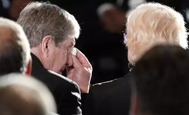 James "Chip" Carter wipes his eyes after speaks during a service for former President Jimmy Carter at the Jimmy Carter Presidential Library and Museum in Atlanta, Saturday, Jan. 4, 2025, as he sits next to his wife Becky. Carter died Dec. 29 at the age of 100. (AP Photo/Alex Brandon, Pool)