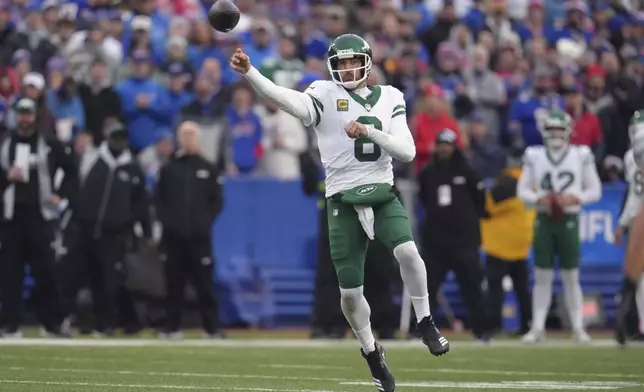 New York Jets quarterback Aaron Rodgers (8) throws against the Buffalo Bills during the second half of an NFL football game, Sunday, Dec. 29, 2024, in Orchard Park, N.Y. (AP Photo/Gene J. Puskar)
