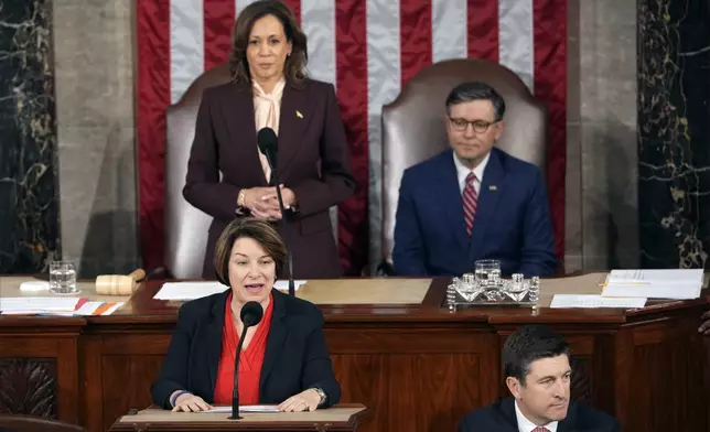 Vice President Kamala Harris and House Speaker Mike Johnson of La., listen as Sen. Amy Klobuchar, D-Minn., reads a certification during a joint session of Congress to confirm the Electoral College votes, affirming President-elect Donald Trump's victory in the presidential election, Monday, Jan. 6, 2025, at the U.S. Capitol in Washington. (AP Photo/Matt Rourke)