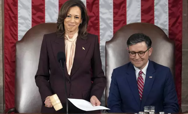 Vice President Kamala Harris reads the results as House Speaker Mike Johnson of La., listens during a joint session of Congress to confirm the Electoral College votes, affirming President-elect Donald Trump's victory in the presidential election, Monday, Jan. 6, 2025, at the U.S. Capitol in Washington. (AP Photo/Matt Rourke)