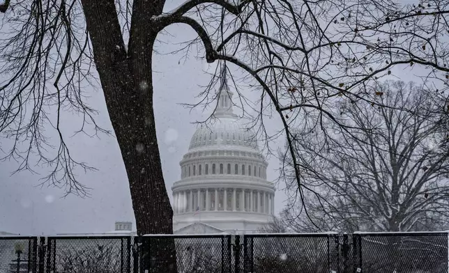 Snow blankets Capitol Hill ahead of a joint session of Congress to certify the votes from the Electoral College in the presidential election, in Washington, Monday, Jan. 6, 2025. (AP Photo/J. Scott Applewhite)