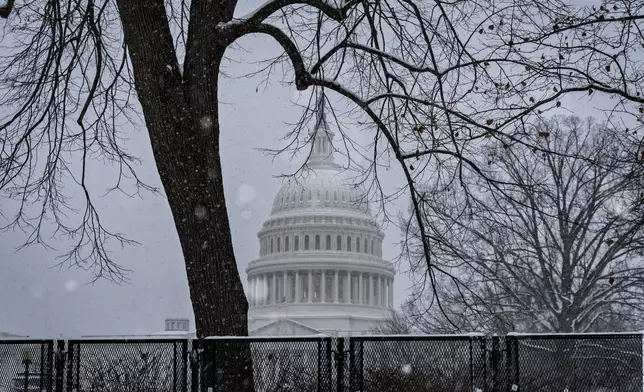 Snow blankets Capitol Hill ahead of a joint session of Congress to certify the votes from the Electoral College in the presidential election, in Washington, Monday, Jan. 6, 2025. (AP Photo/J. Scott Applewhite)