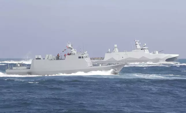 A Taiwan's domestically made Tuo Chiang patrol ship, right, and a Kuang Hua VI-class missile boat are seen during a simulated attack drill off Kaohsiung City, southern Taiwan, Thursday, Jan. 9, 2025. (AP Photo/Chiang Ying-ying)