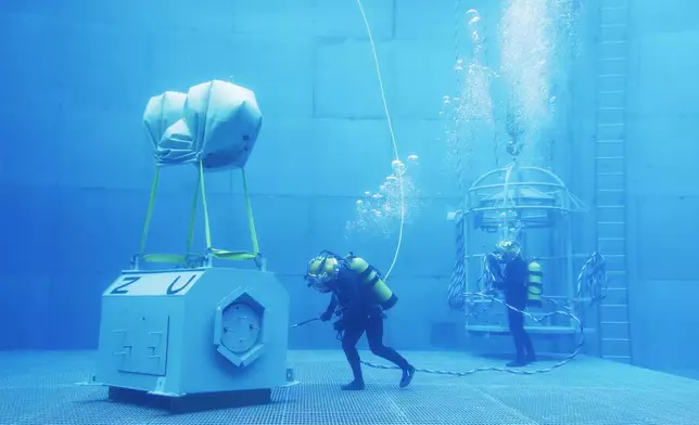 Taiwanese navy divers perform underwater mission during a drill in Kaohsiung City, southern Taiwan, Thursday, Jan. 9, 2025. (AP Photo/Chiang Ying-ying)