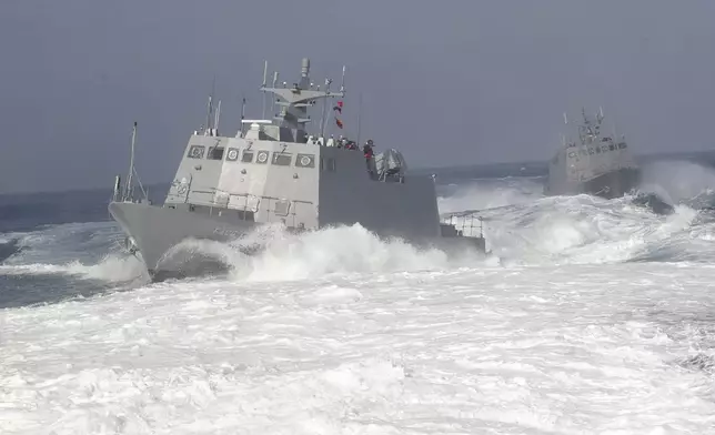 Two Kuang Hua VI-class missile boats are seen during a simulated attack drill off Kaohsiung City, southern Taiwan, Thursday, Jan. 9, 2025. (AP Photo/Chiang Ying-ying)