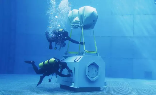 Taiwanese navy divers perform underwater mission during a drill in Kaohsiung City, southern Taiwan, Thursday, Jan. 9, 2025. (AP Photo/Chiang Ying-ying)