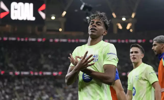 Barcelona's Lamine Yamal celebrates after scoring during the Spanish Super Cup semifinal match between Athletic Bilbao and Barcelona in Jeddah, Saudi Arabia, on Wednesday, Jan. 8, 2025. (AP Photo/Altaf Qadri)