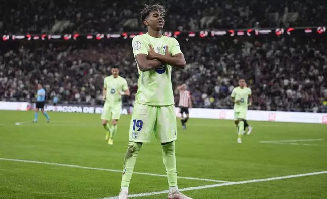 Barcelona's Lamine Yamal celebrates after scoring during the Spanish Super Cup semifinal match between Athletic Bilbao and Barcelona in Jeddah, Saudi Arabia, on Wednesday, Jan. 8, 2025. (AP Photo/Altaf Qadri)