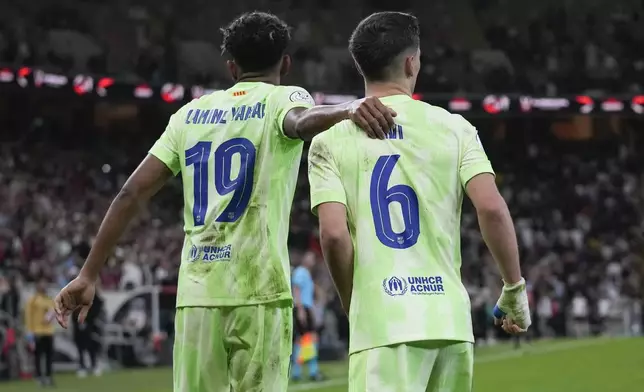 Barcelona's Lamine Yamal, left, and Gavi celebrate after the goal during the Spanish Super Cup semifinal match between Athletic Bilbao and Barcelona in Jeddah, Saudi Arabia, on Wednesday, Jan. 8, 2025. (AP Photo/Altaf Qadri)