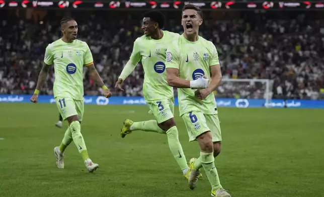 Barcelona's Gavi, front, celebrates after scoring during the Spanish Super Cup semifinal match between Athletic Bilbao and Barcelona in Jeddah, Saudi Arabia, on Wednesday, Jan. 8, 2025. (AP Photo/Altaf Qadri)