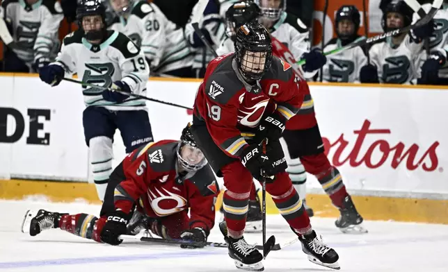 Ottawa Charge's Brianne Jenner (19) skates with the puck during first-period PWHL hockey game action against the Boston Fleet in Ottawa, Ontario, Saturday, Jan. 11, 2025. (Justin Tang/The Canadian Press via AP)