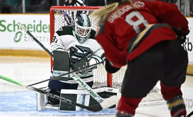 Boston Fleet goaltender Aerin Frankel (31) makes a save against Ottawa Charge's Natalie Snodgrass (8) during third-period PWHL hockey game action in Ottawa, Ontario, Saturday, Jan. 11, 2025. (Justin Tang/The Canadian Press via AP)