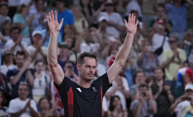 FILE - Andy Murray of Britain cries and waves to the spectators after he and his partner Daniel Evans defeated by Taylor Fritz and Tommy Paul of the United States in the men's doubles quarterfinals tennis match, at the 2024 Summer Olympics, Thursday, Aug. 1, 2024, at the Roland Garros stadium in Paris, France. (AP Photo/Andy Wong, File)