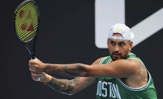 Australia's Nick Kyrgios plays a backhand return during a practice session ahead of the Australian Open tennis championship in Melbourne, Australia, Friday, Jan. 10, 2025. (AP Photo/Vincent Thian)