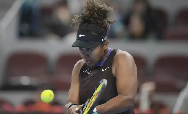 FILE - Naomi Osaka of Japan returns a shot to Coco Gauff of the United States in a women's singles match for the China Open tennis tournament held at the National Tennis Center in Beijing, Tuesday, Oct. 1, 2024. (AP Photo/Achmad Ibrahim, File)