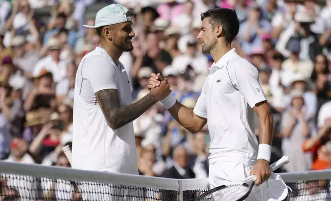 FILE - Serbia's Novak Djokovic, right, celebrates beating Australia's Nick Kyrgios in the final of the men's singles on day fourteen of the Wimbledon tennis championships in London, Sunday, July 10, 2022. (AP Photo/Kirsty Wigglesworth, File)