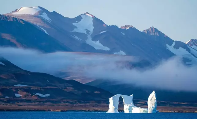 FILE - An iceberg floats in the Scoresby Sund, on Sept. 12, 2023, in Greenland. (AP Photo/Chris Szagola, File)