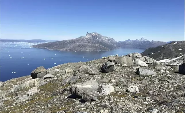 FILE - Small pieces of ice float in the water in Nuuk Fjord, Greenland, on June 15, 2019. (AP Photo/Keith Virgo, File)