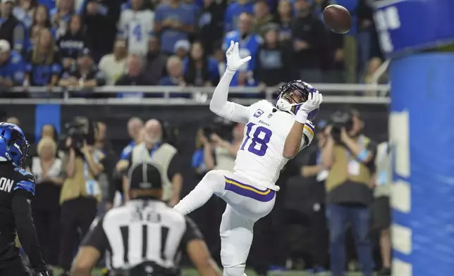 Minnesota Vikings wide receiver Justin Jefferson (18) can't make a catch against the Detroit Lions during the first half of an NFL football game Sunday, Jan. 5, 2025, in Detroit. (AP Photo/Charlie Riedel)