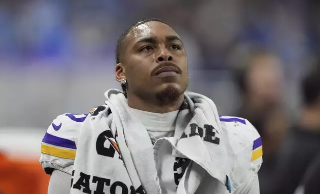 Minnesota Vikings wide receiver Justin Jefferson watches from the sidelines during the final minutes of the second half of an NFL football game against the Detroit Lions, Sunday, Jan. 5, 2025, in Detroit. (AP Photo/Charlie Riedel)