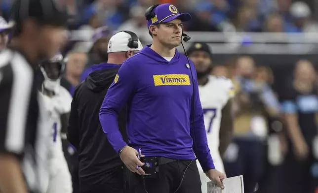 Minnesota Vikings head coach Kevin O'Connell watches from the sidelines during the first half of an NFL football game against the Detroit Lions, Sunday, Jan. 5, 2025, in Detroit. (AP Photo/Charlie Riedel)