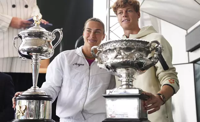 Defending champions Aryna Sabalenka and Jannik Sinner attend the official draw ceremony ahead of the Australian Open tennis championship in Melbourne, Australia, Thursday, Jan. 9, 2025. (AP Photo/Vincent Thian)