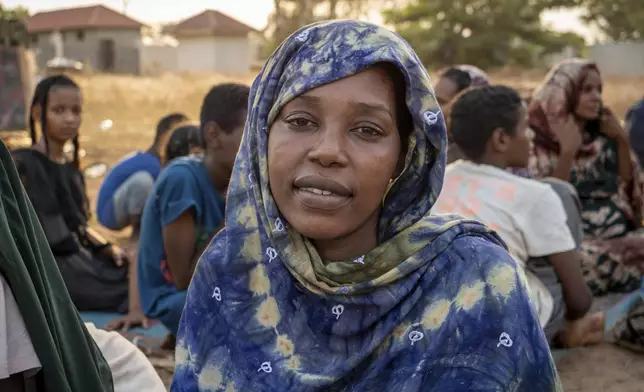 Gisma Adam Idris, 23, who fled the war in Al-Fasher in Sudan's western Darfur region nine months ago with her husband and two children, seek refuge at the South Sudan People's Defense Forces (SSPDF) headquarters in Juba, South Sudan, on Friday, Jan. 17, 2025. (AP Photo/Florence Miettaux)