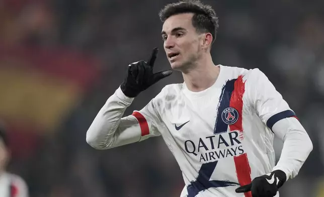 PSG's Fabian Ruiz celebrates after he scored his side's first goal during the French League One soccer match between Lens and Paris Saint-Germain, at the Bollaert-Delelis stadium in Lens, France, Saturday, Jan. 18, 2025. (AP Photo/Thibault Camus)