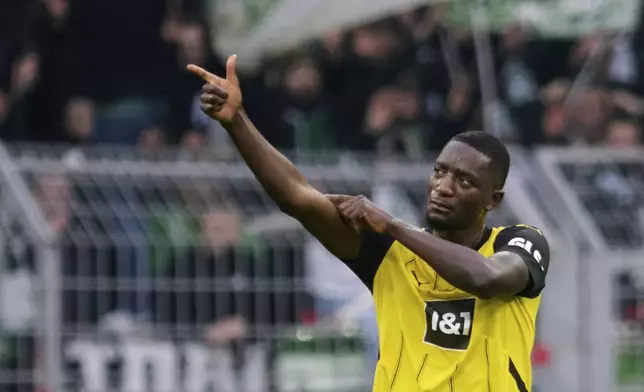 Dortmund's Serhou Guirassy celebrates scoring during the Bundesliga soccer match between Borussia Dortmund and Werder Bremen at Signal Iduna Park, Dortmund, Germany, Saturday Jan. 25, 2025. (Bernd Thissen/dpa via AP)
