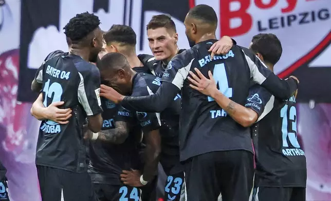 Leverkusen's players around Patrik Schick during the German Bundesliga soccer match between RB Leipzig and Bayer 04 Leverkusen in Leipzig, Germany, on Saturday, Jan. 25, 2025. (Jan Woitas/dpa via AP)