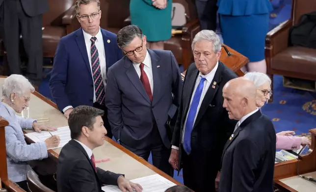 Speaker of the House Mike Johnson, R-La., third right, stands with with conservative Republican members, from left, Rep. Andy Ogles, R-Tenn., Rep. Ralph Norman, R-S.C., and Rep. Keith Self, R-Texas, as the Freedom Caucus members agree to change their vote in favor of Johnson to stay on as speaker, as the House of Representatives convenes the new 119th Congress with a slim Republican majority, at the Capitol in Washington, Friday, Jan. 3, 2025. (AP Photo/J. Scott Applewhite)