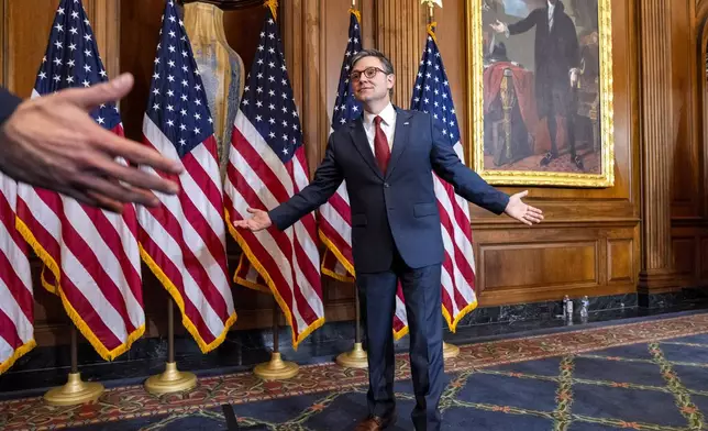 House Speaker Mike Johnson, R-La., greets families of members during a ceremonial swearing-in in the Rayburn Room at the Capitol in Washington, Friday, Jan. 3, 2025. (AP Photo/Jacquelyn Martin)