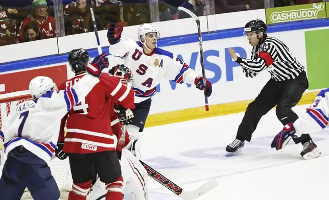 FILE - USA's Auston Matthews, center, celebrates his 4-2 goal during the 2016 IIHF World Junior Ice Hockey Championship match between USA and Canada in Helsinki, Finland Saturday, Dec. 26, 2015. (Roni Rekomaa/Lehtikuva via AP, File)