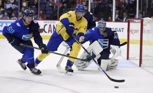 FILE - Sweden defenseman Victor Hedman, center, battles for the puck against Europe goalie Jaroslav Halak, right, of Slovakia, and Europe defenseman Roman Josi, left, of Switzerland, during the second period of an exhibition game, part of the World Cup of Hockey, Wednesday, Sept. 14, 2016, in Washington. (AP Photo/Nick Wass, File)