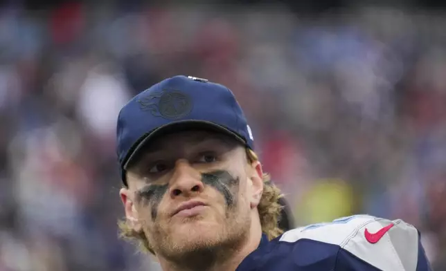 Tennessee Titans quarterback Will Levis (8) looks on from the sideline during the second half of an NFL football game against the Cincinnati Bengals, Sunday, Dec. 15, 2024, in Nashville, Tenn. (AP Photo/George Walker IV)