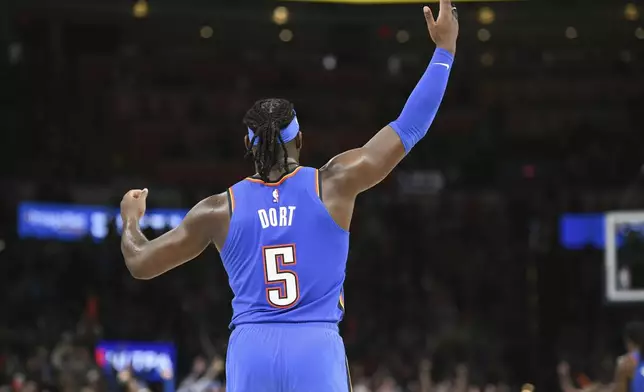 OKlahoma City Thunder guard Luguentz Dort celebrates during the second half of an NBA basketball game against the Minnesota Timberwolves, Tuesday, Dec. 31, 2024, in Oklahoma City. (AP Photo/Kyle Phillips)